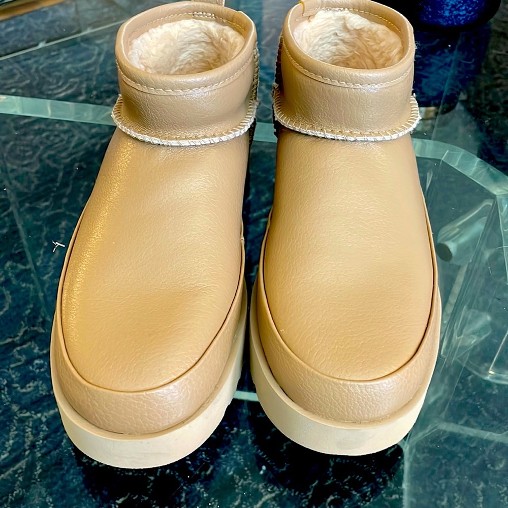 Mini Uggs. Worn just a few times, in like new condition. Real!